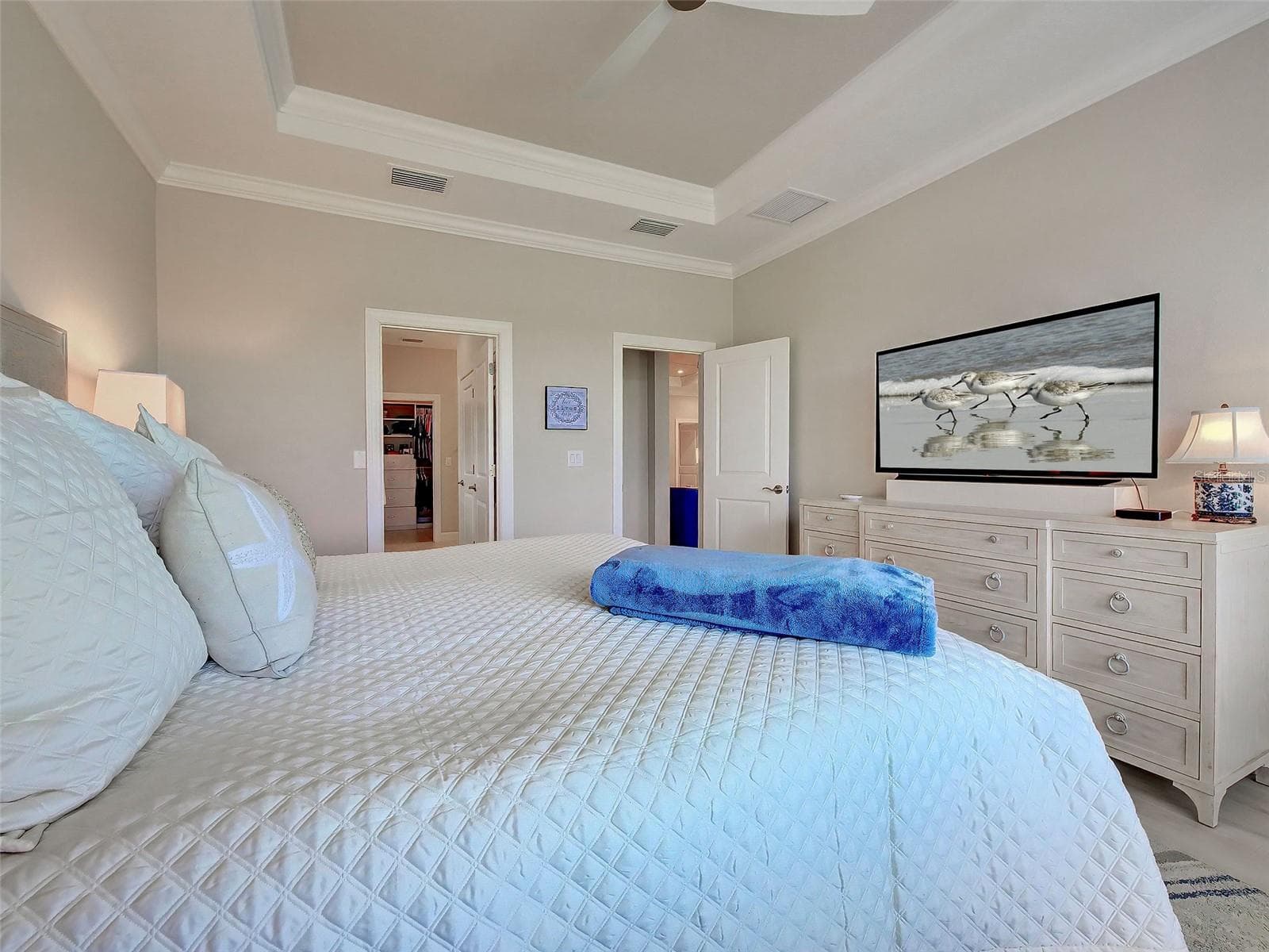 There is a walk-in closet and ensuite bathroom in the primary bedroom. - 5616 SCARLOTTI ST, NOKOMIS