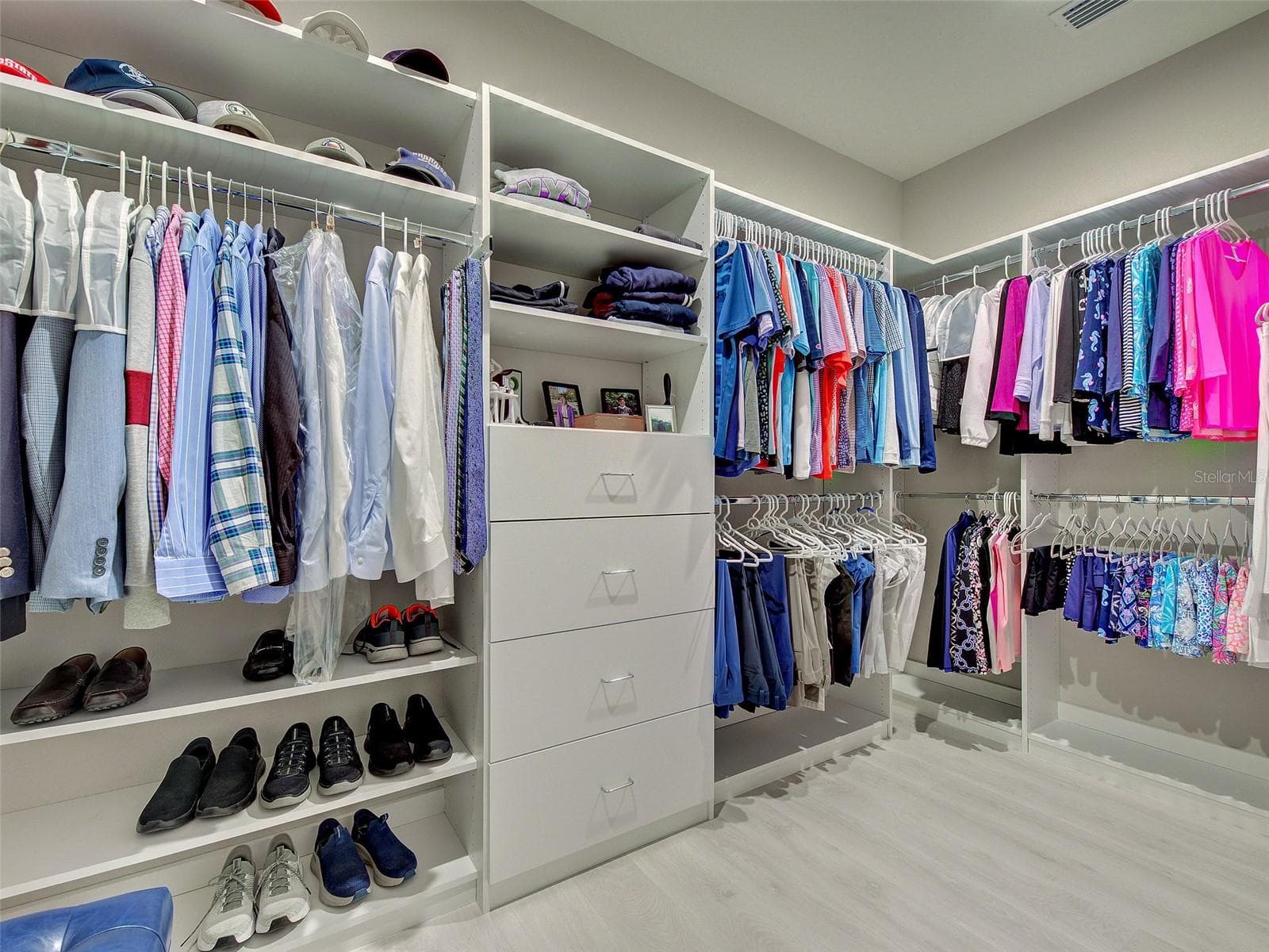 Custom Walk in closet is huge with room to hang clothes, shelves and drawers. - 5616 SCARLOTTI ST, NOKOMIS