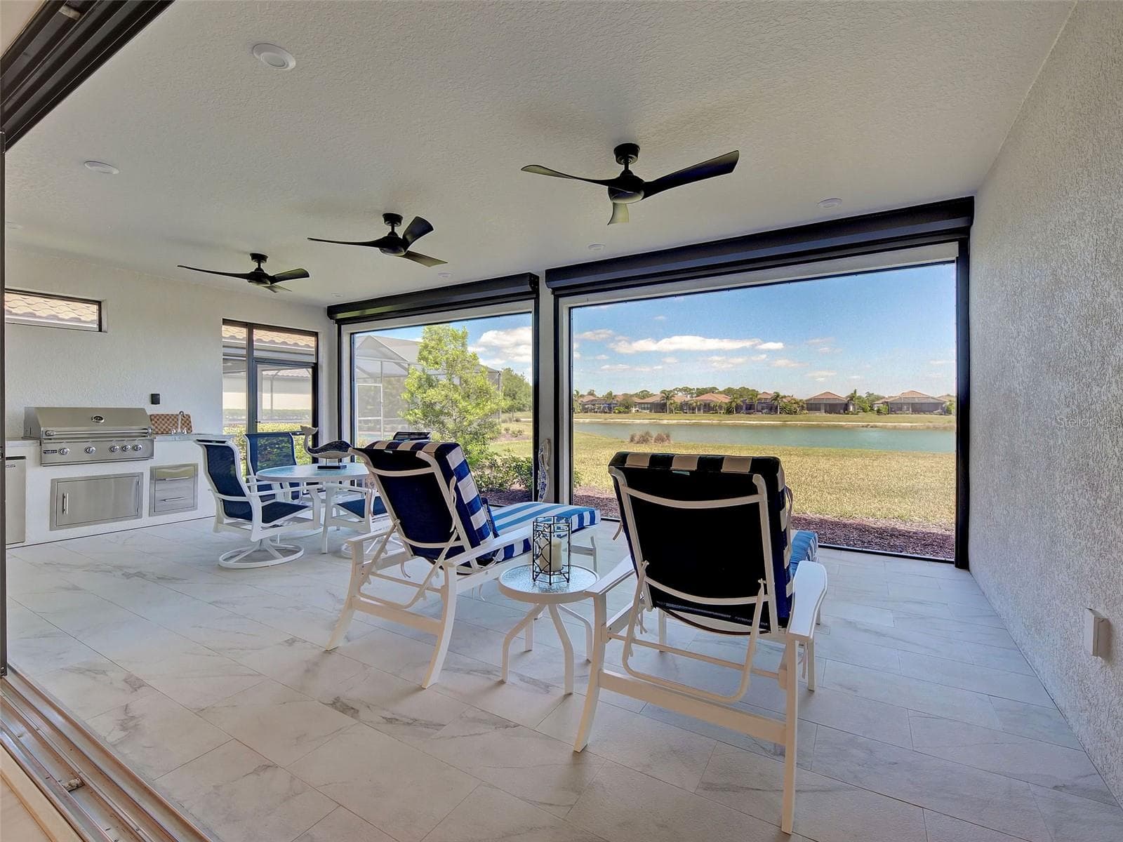 Enjoy relaxing on the lanai with this gorgeous water view. - 5616 SCARLOTTI ST, NOKOMIS