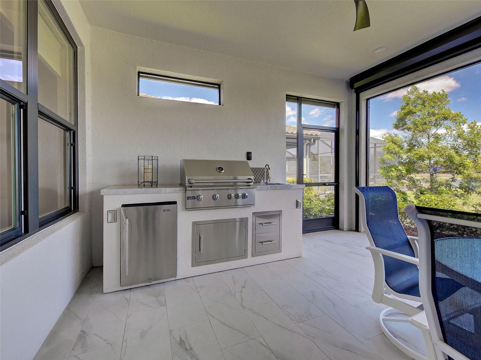 The Florida room also has a cooking center complete with a refrigerator and sink. - 5616 SCARLOTTI ST, NOKOMIS