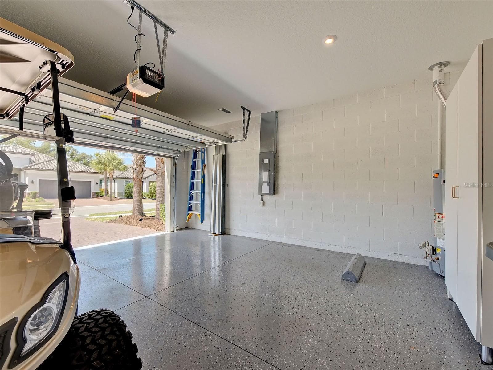 The garage has a finished floor. - 5616 SCARLOTTI ST, NOKOMIS
