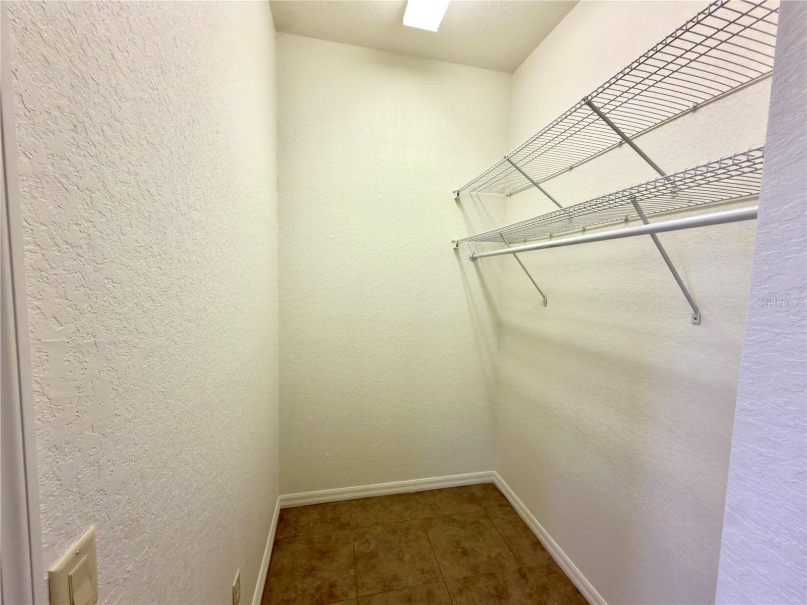Primary bedroom closet #1 - 24087 TWISTER LN, BROOKSVILLE