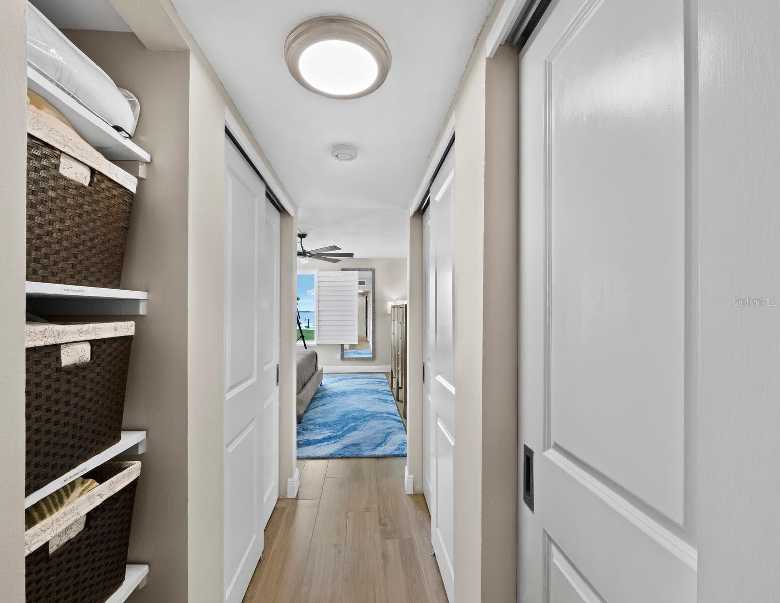 Built in closets lining the hallway to the Primary Bedroom! - 448 GULF OF MEXICO DR #A104, LONGBOAT KEY