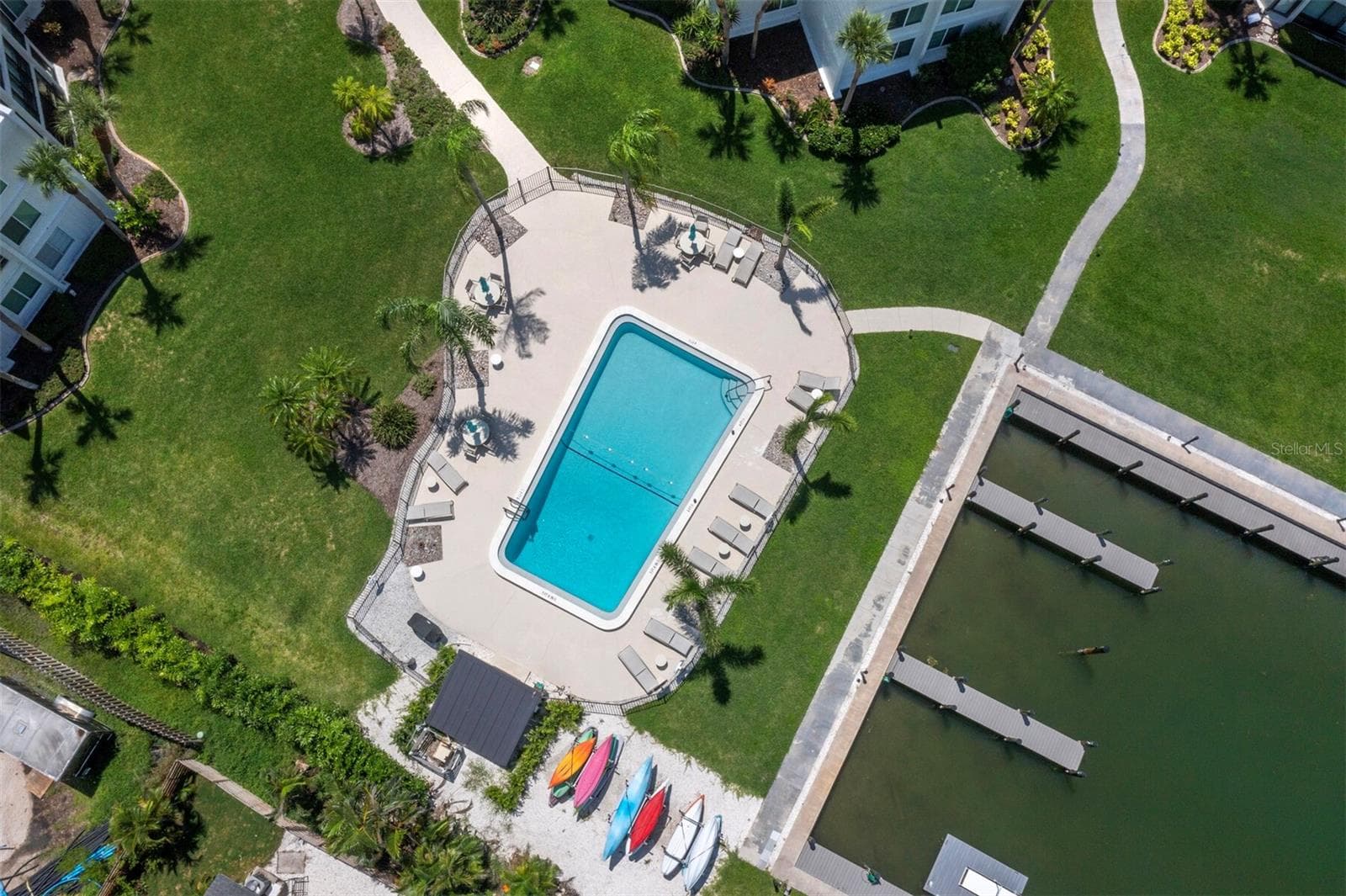from the rising sun through the evening, enjoy the sunshine at the pool, on the pool deck or throwing a line from the seawall! - 448 GULF OF MEXICO DR #A104, LONGBOAT KEY