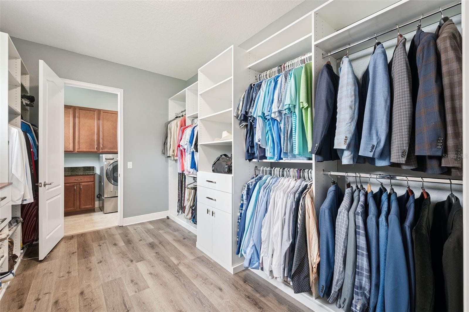 Primary Walk-In Closet connected to the Laundry Room - 14156 ALAFAYA OAK BND, ORLANDO