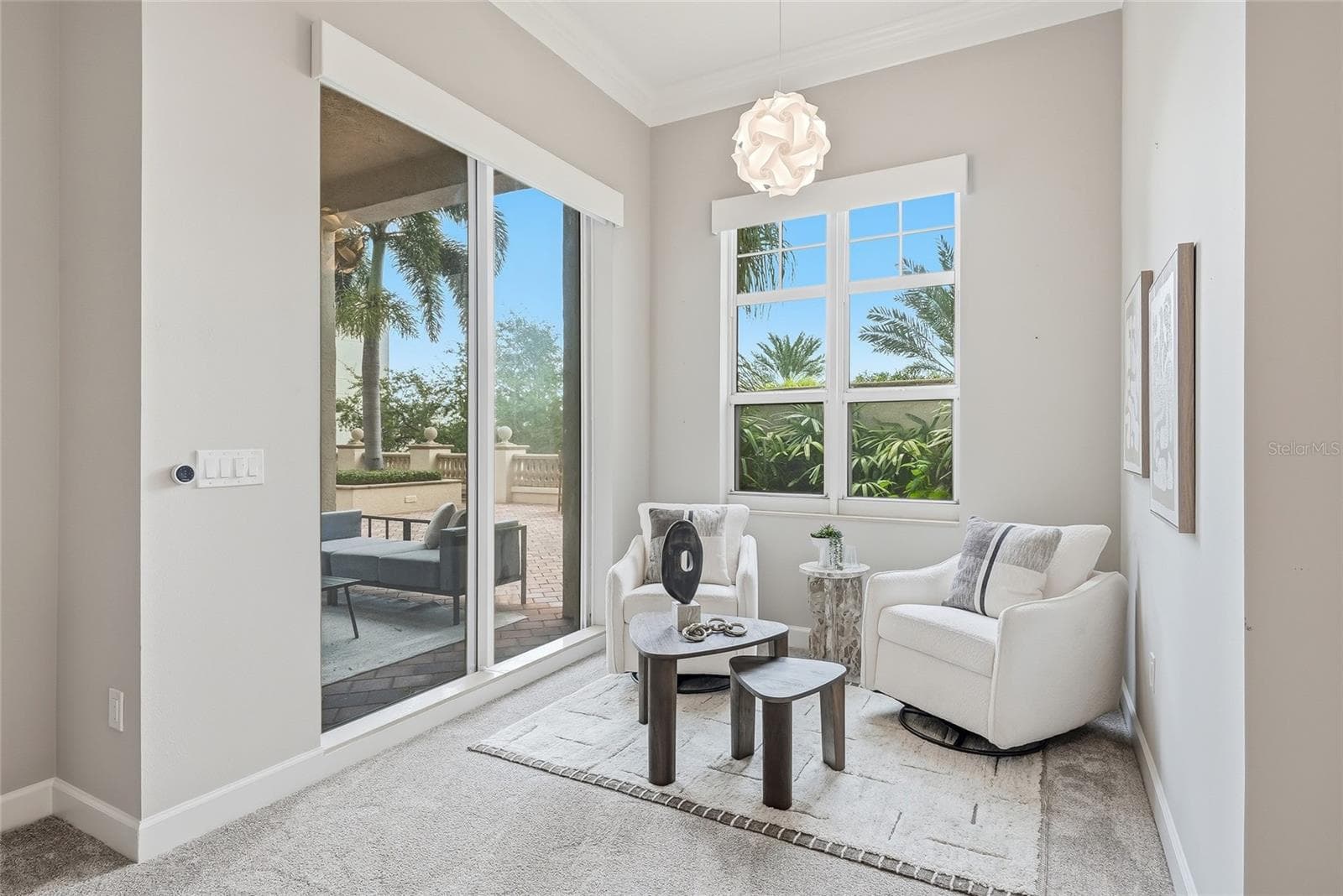 Dedicated sitting area in primary bedroom with terrace access. - 100 BEACH DR NE #301, ST PETERSBURG