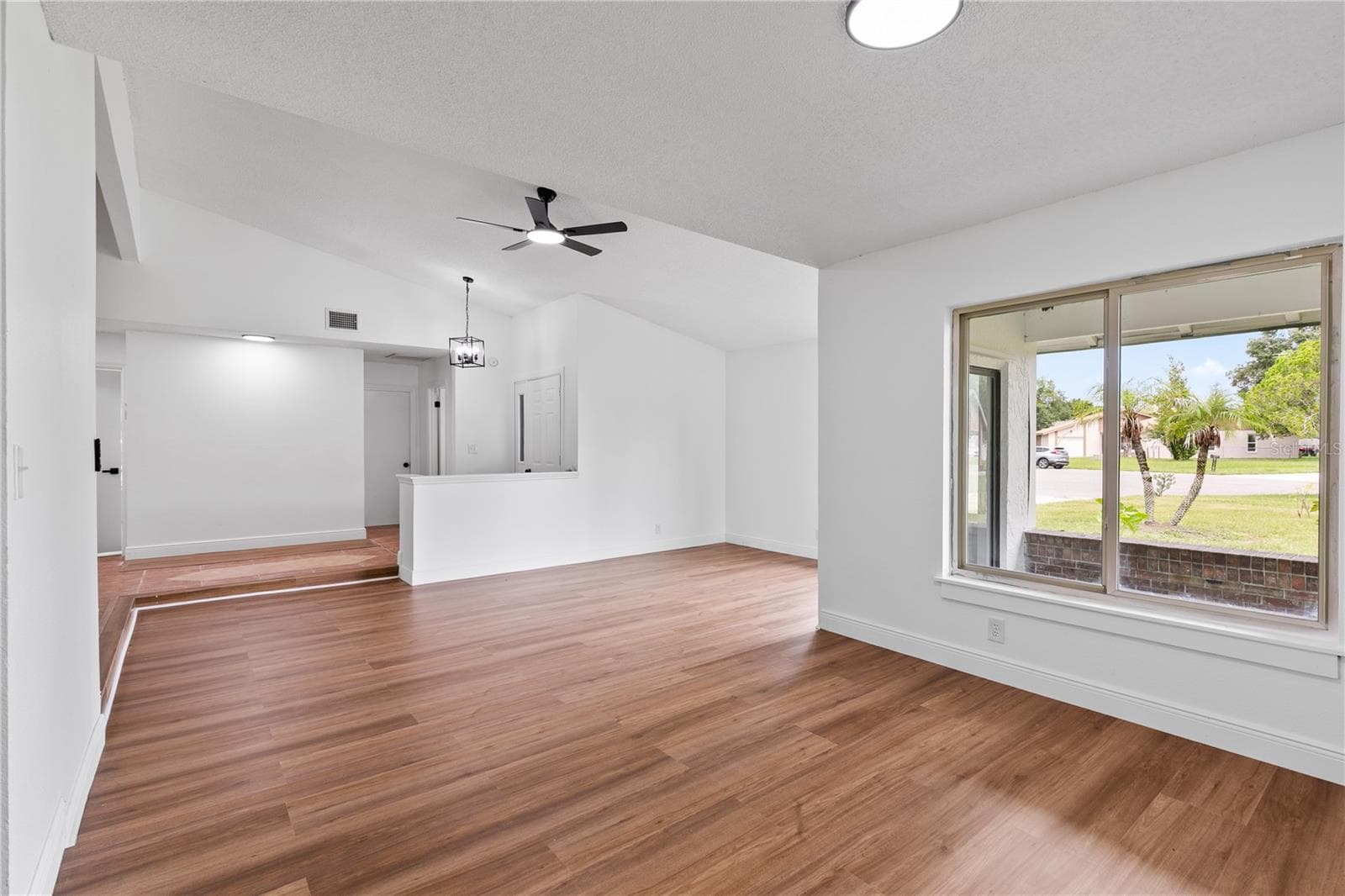 View from dining room to living room - 714 DIVOT LN, POINCIANA