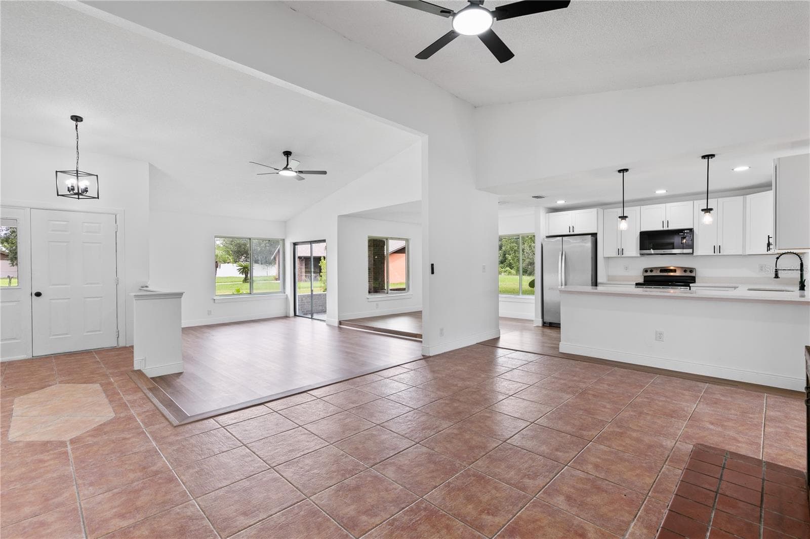 View from the family room towards the front door and living room - 714 DIVOT LN, POINCIANA