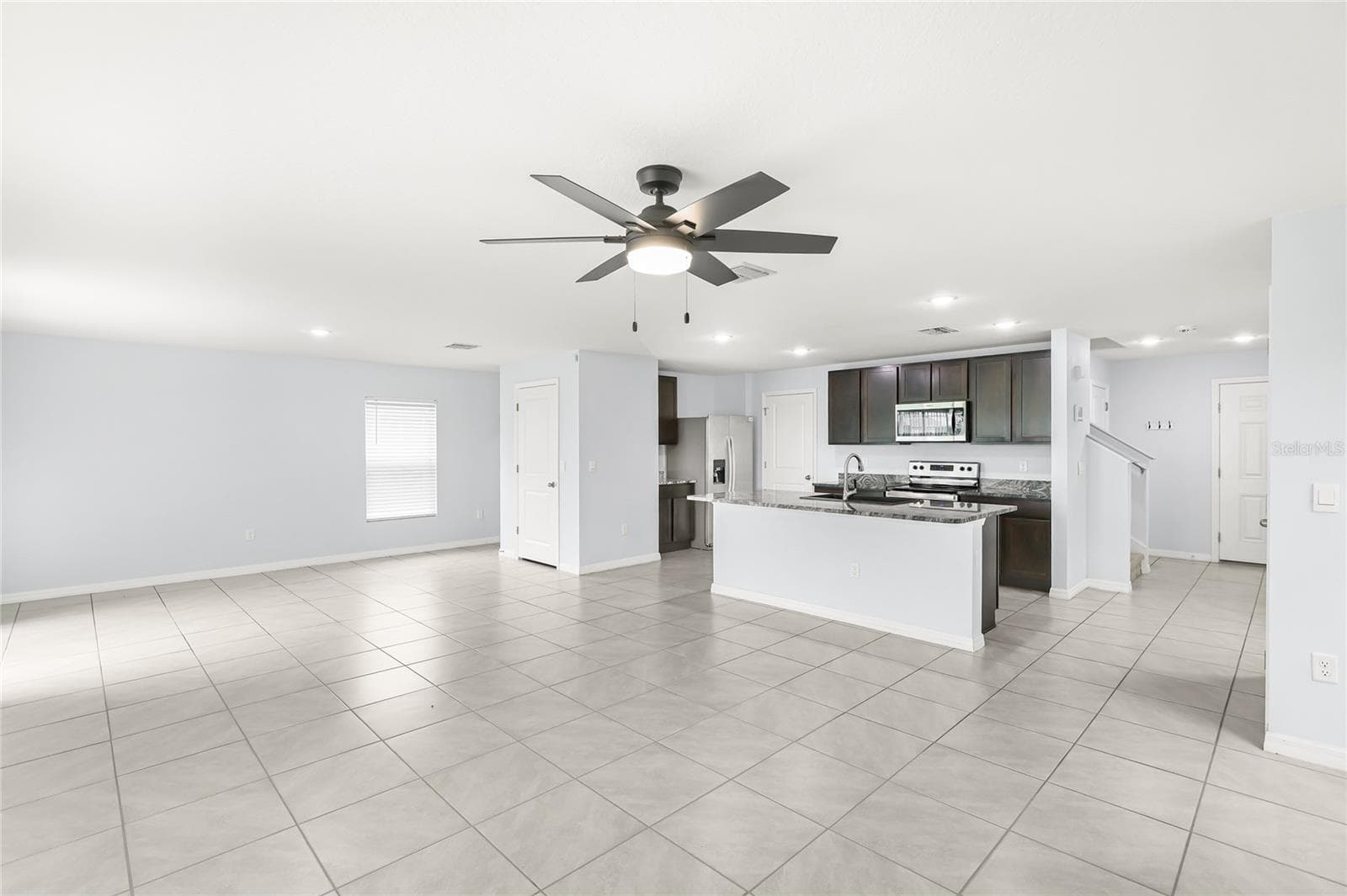 Living room, dining and kitchen - 10116 CHARLOTTE DR, PARRISH
