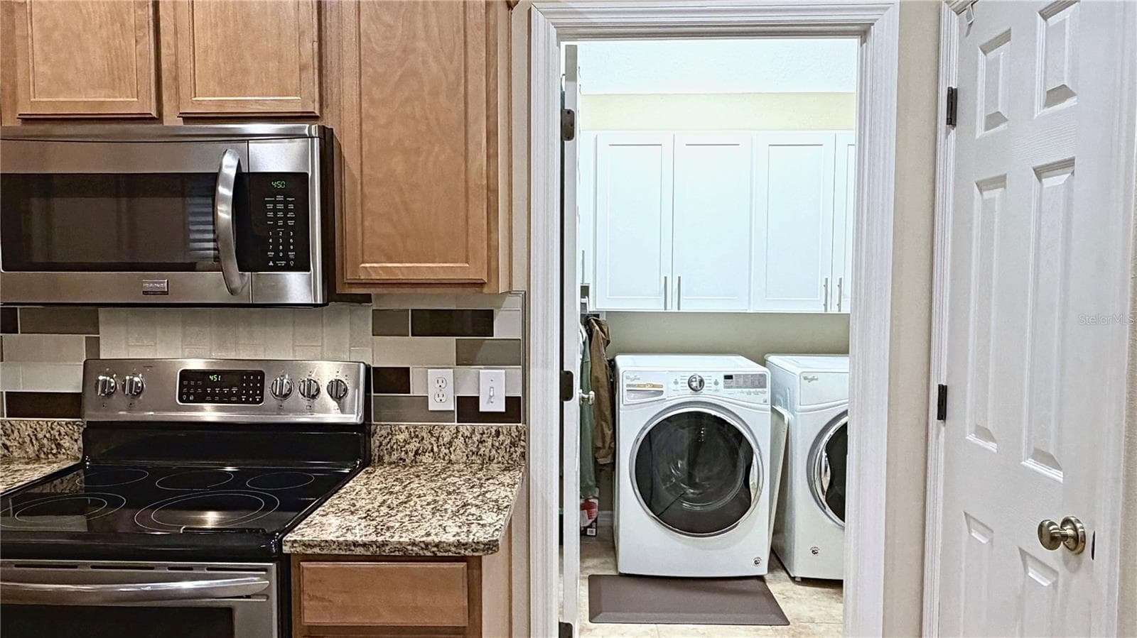 Kitchen and laundry room - 8240 ACADIAN LN, SEMINOLE