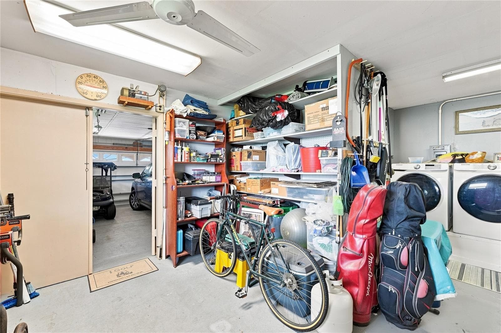 Incredible Large Garage Workshop, Laundry with Plenty of Work Space & Storage - 1405 HACIENDA DR, SUN CITY CENTER