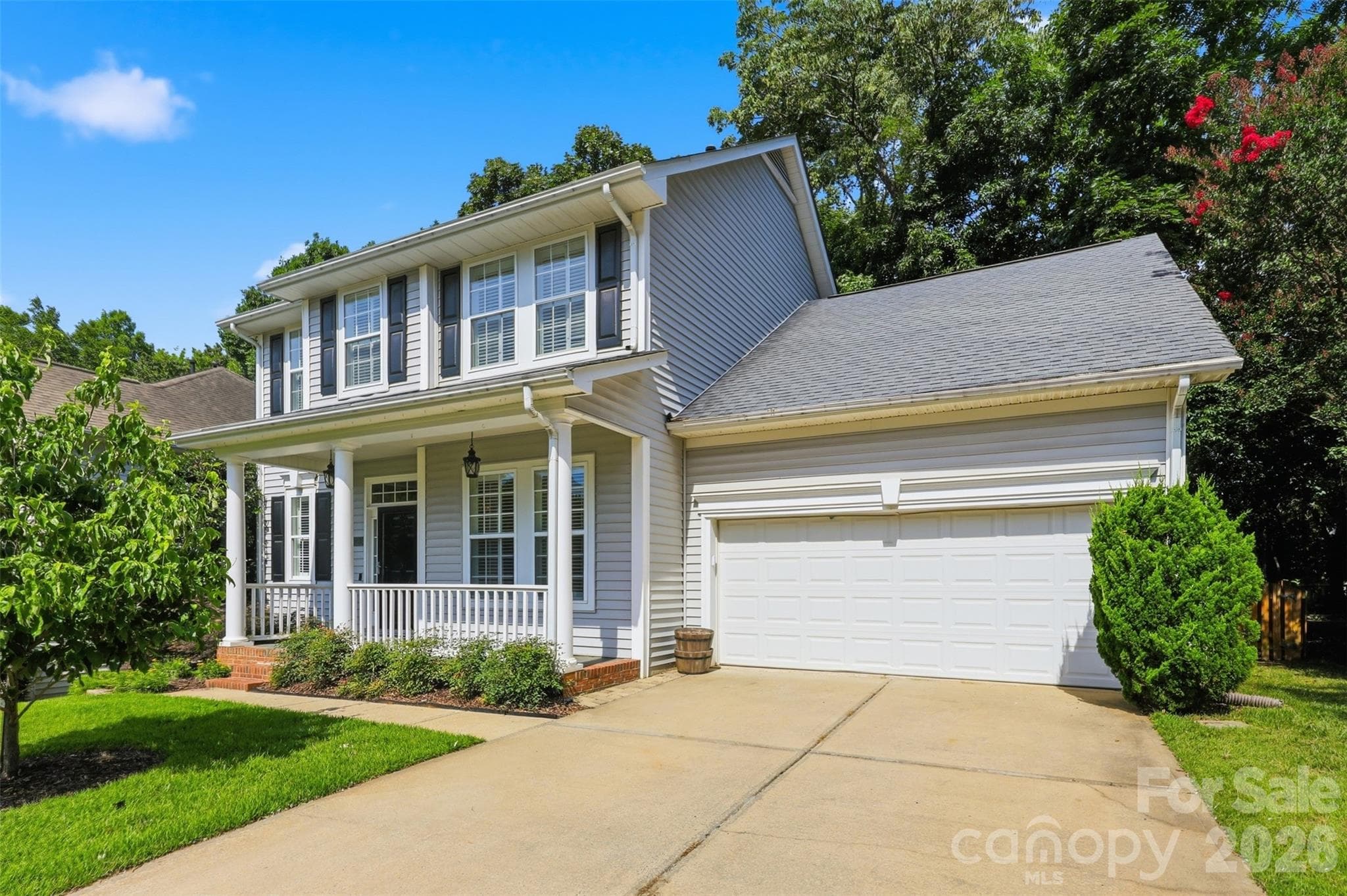 Custom built-in storage in the 2-car garage keeps everything organized and out of sight! - 6832 Charter Hills Road, Charlotte