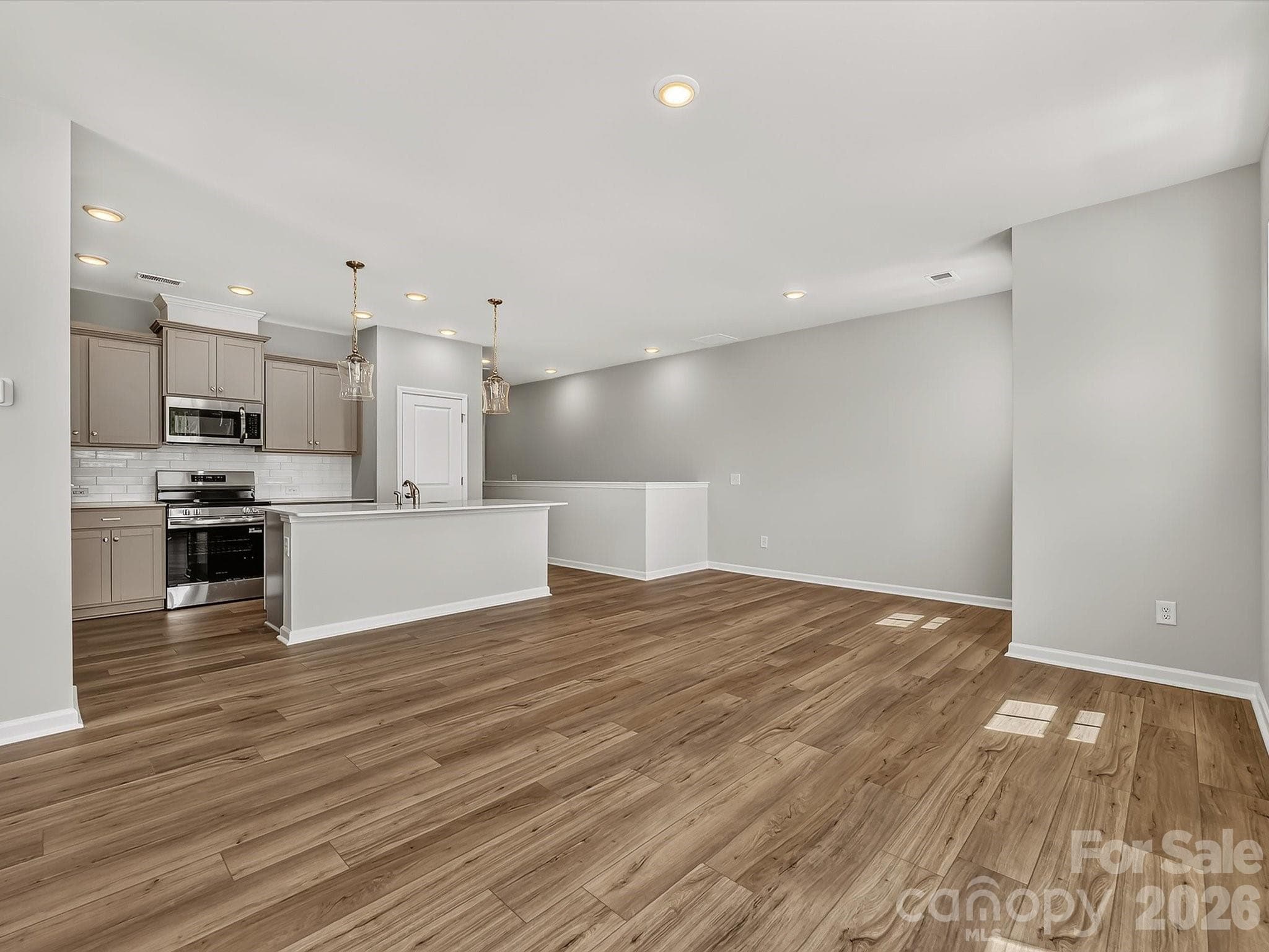 Open Floorplan with the Living room, Dining Area and Kitchen Flowing Naturally, perfect for entertaining - Charlotte