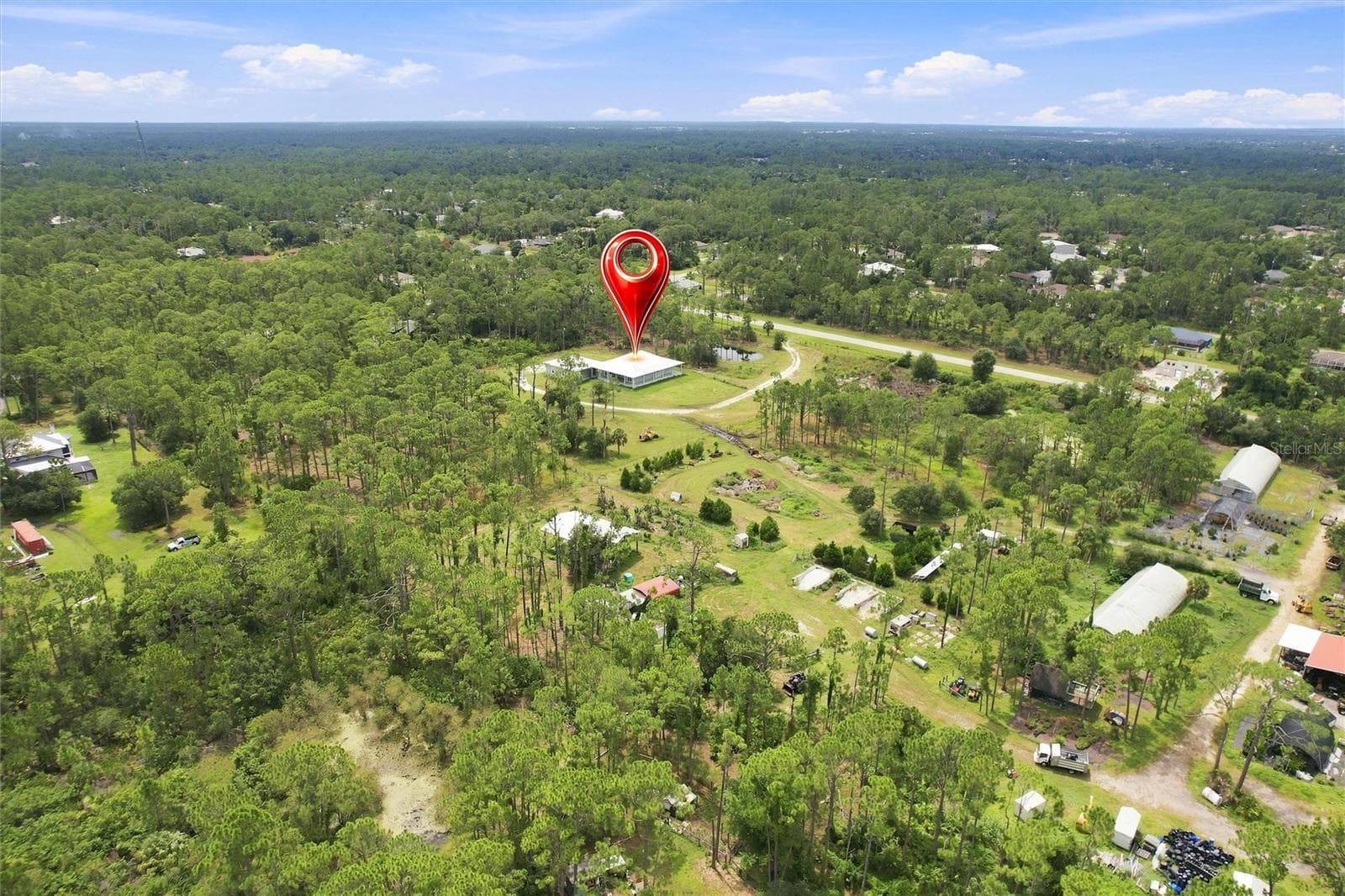 including aerial view of home,land, and nursery - 8146 TROPICAIRE BLVD, NORTH PORT