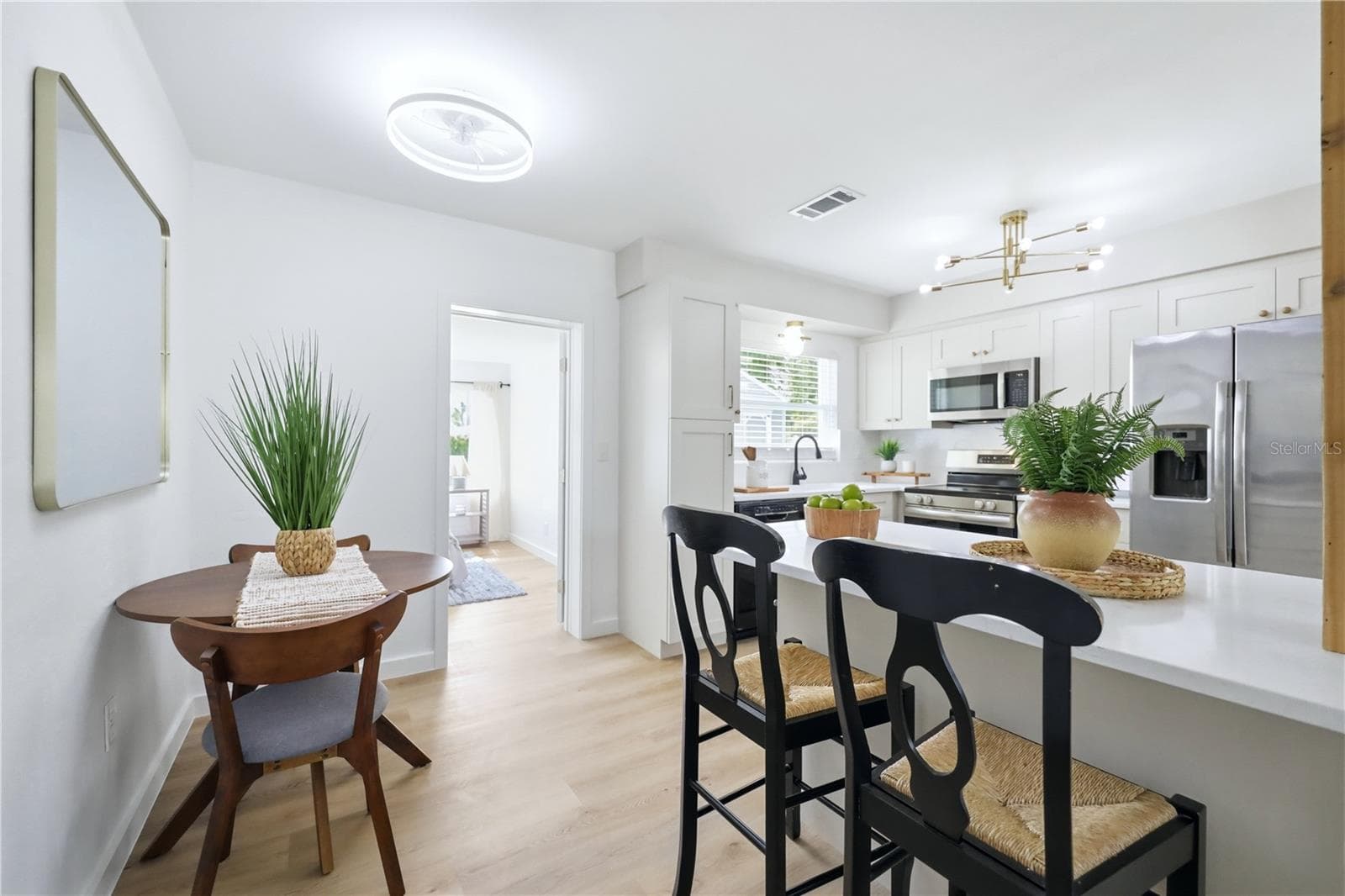 Open dining and kitchen area with new kitchen island - 6103 CARLTON AVE, SARASOTA