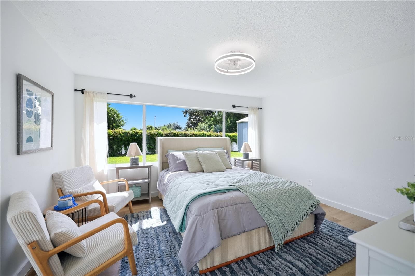 Primary bedroom with en suite bathroom and lots of light. - 6103 CARLTON AVE, SARASOTA