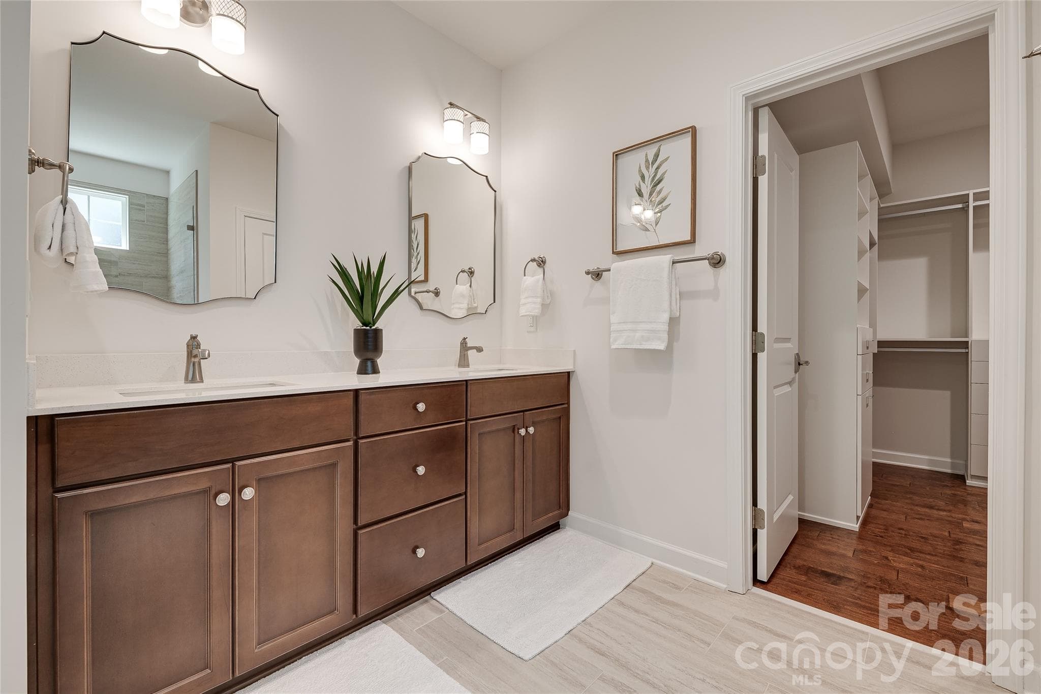 Beautiful double sink vanity with under mount sinks in the primary bathroom. - 2566 NW Red Hill Street, Concord