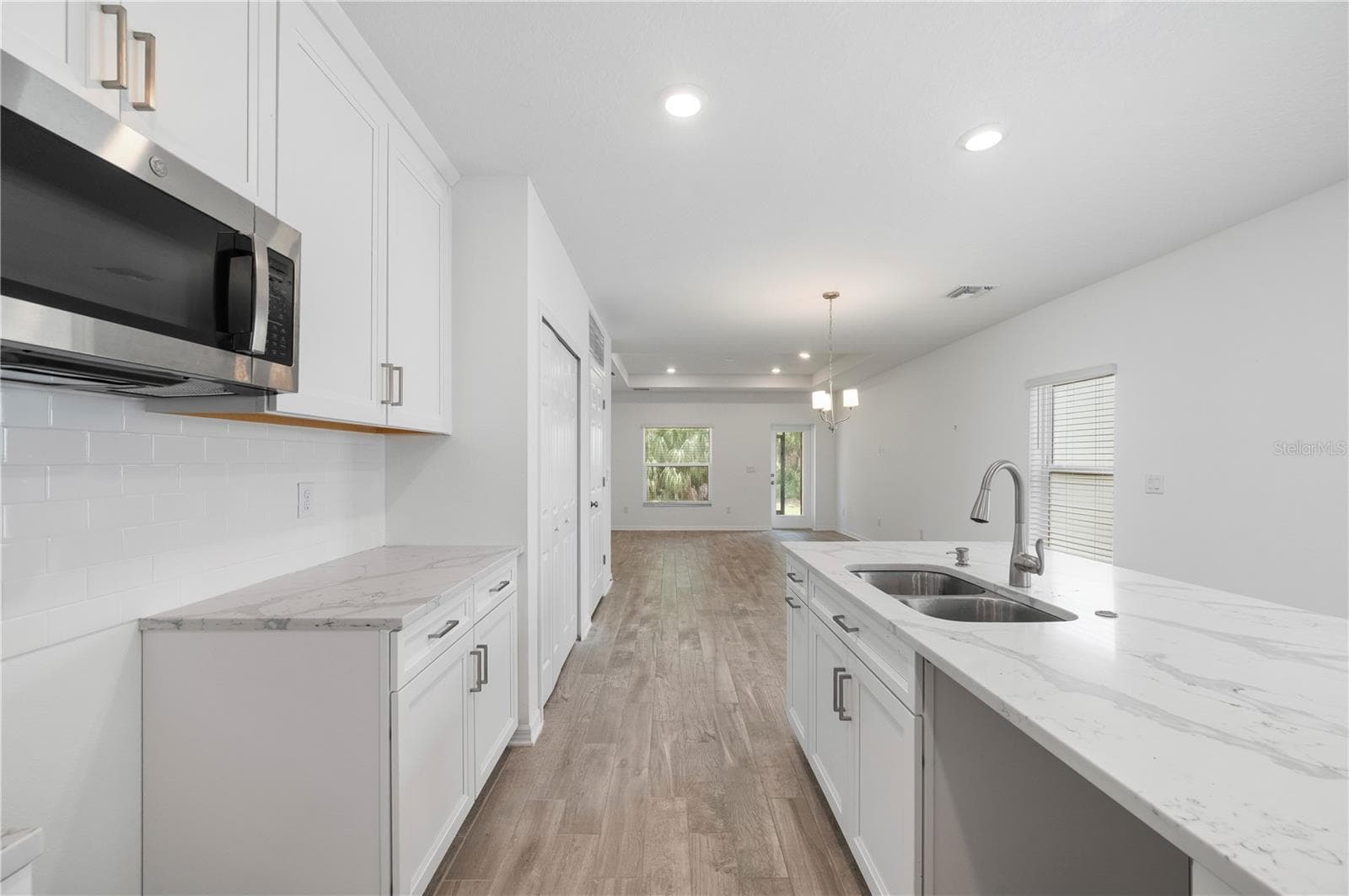 Kitchen with island sink and eat at counter - 1968 SUNSET PRESERVE WAY, PORT CHARLOTTE
