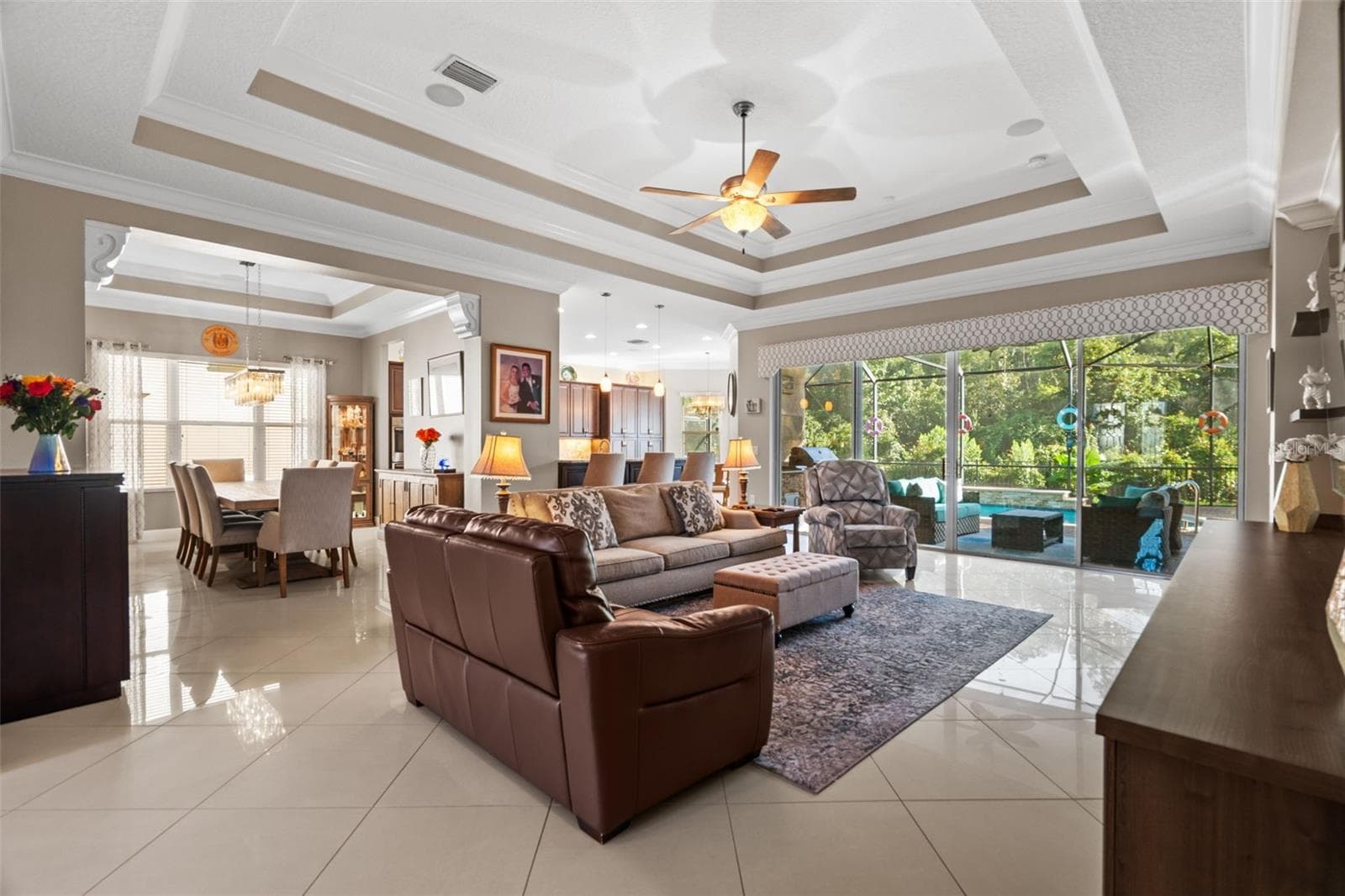Great Room with tray ceilings - 30581 IVY FORGE CT, WESLEY CHAPEL