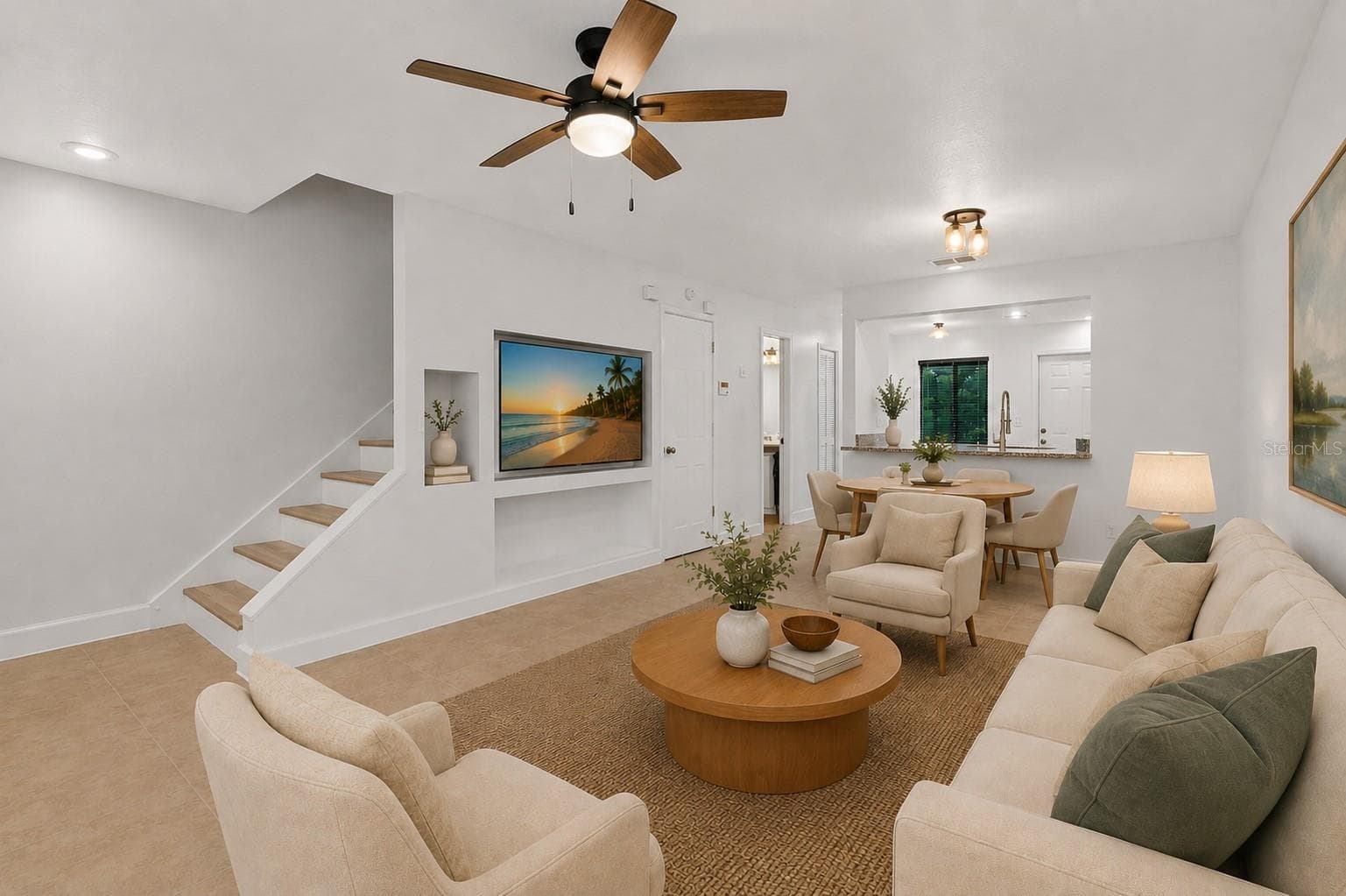 Virtual staged. The main level features a spacious open living and dining area with plenty of room to create separate gathering and dining spaces while maintaining an easy flow throughout the home. - 283 SANDLEWOOD TRL #3, WINTER PARK