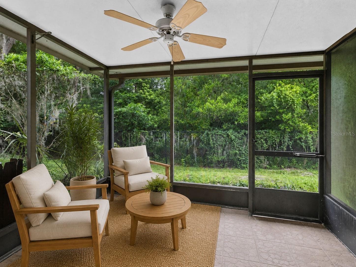 Virtual staged. Step outside to the private screened porch overlooking conservation, creating a peaceful outdoor space with added privacy and no rear neighbors directly behind you. - 283 SANDLEWOOD TRL #3, WINTER PARK