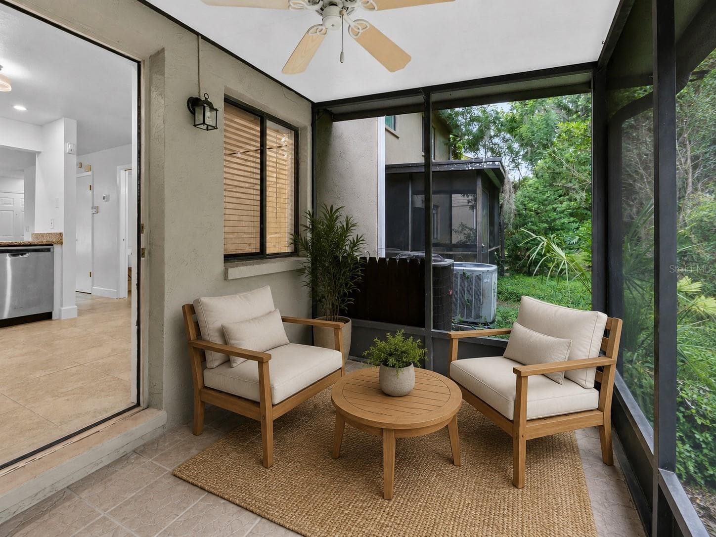 Virtual staged. Step outside to the private screened porch overlooking conservation, creating a peaceful outdoor space with added privacy and no rear neighbors directly behind you. - 283 SANDLEWOOD TRL #3, WINTER PARK