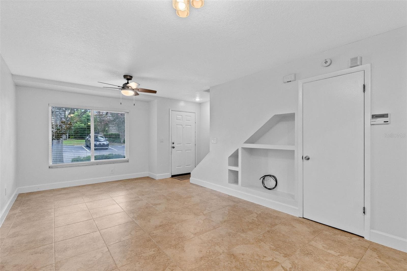 The main level features a spacious open living and dining area with plenty of room to create separate gathering and dining spaces while maintaining an easy flow throughout the home. - 283 SANDLEWOOD TRL #3, WINTER PARK