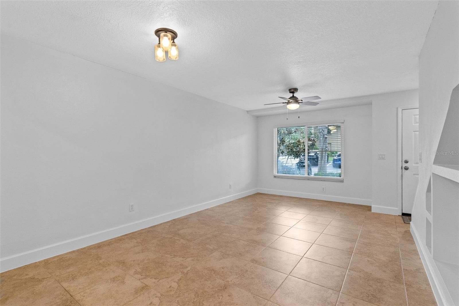 The main level features a spacious open living and dining area with plenty of room to create separate gathering and dining spaces while maintaining an easy flow throughout the home. - 283 SANDLEWOOD TRL #3, WINTER PARK