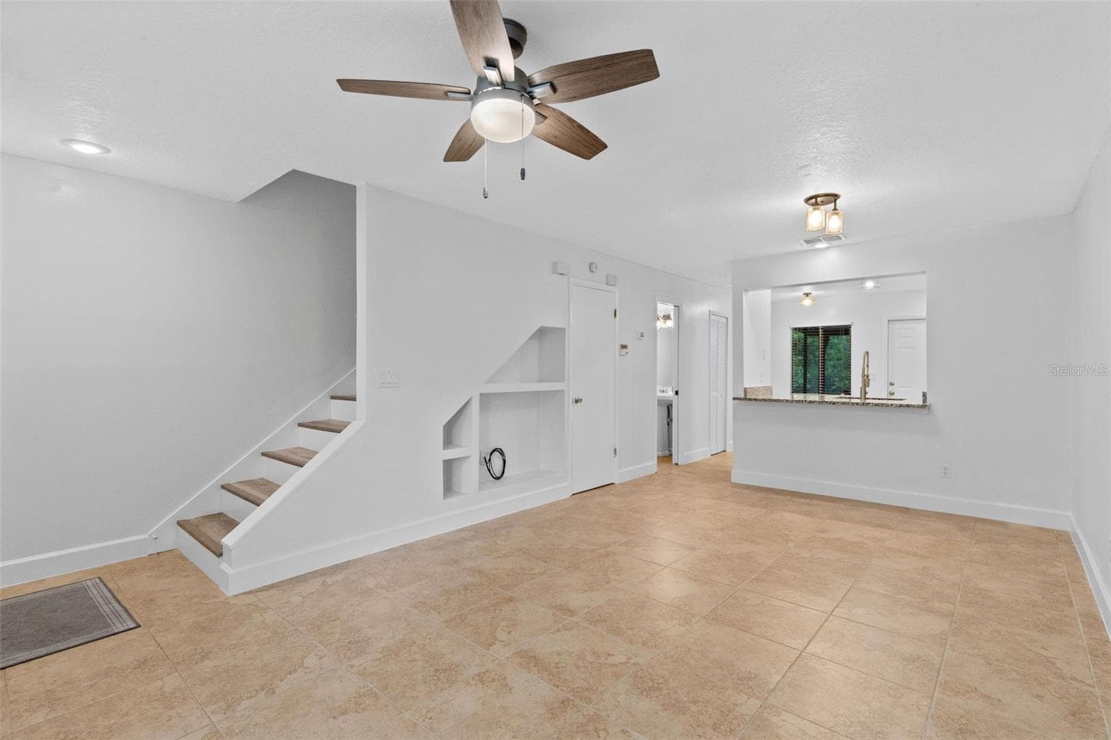 The main level features a spacious open living and dining area with plenty of room to create separate gathering and dining spaces while maintaining an easy flow throughout the home. - 283 SANDLEWOOD TRL #3, WINTER PARK