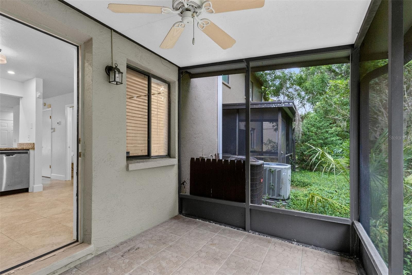 Step outside to the private screened porch overlooking conservation, creating a peaceful outdoor space with added privacy and no rear neighbors directly behind you.Upstairs, the primary bedroom features a private en suite bathro - 283 SANDLEWOOD TRL #3, WINTER PARK