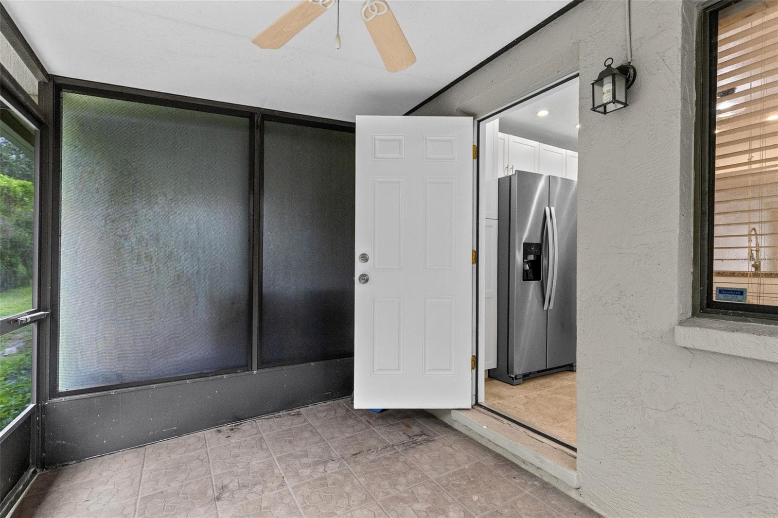 Step outside to the private screened porch overlooking conservation, creating a peaceful outdoor space with added privacy and no rear neighbors directly behind you. - 283 SANDLEWOOD TRL #3, WINTER PARK
