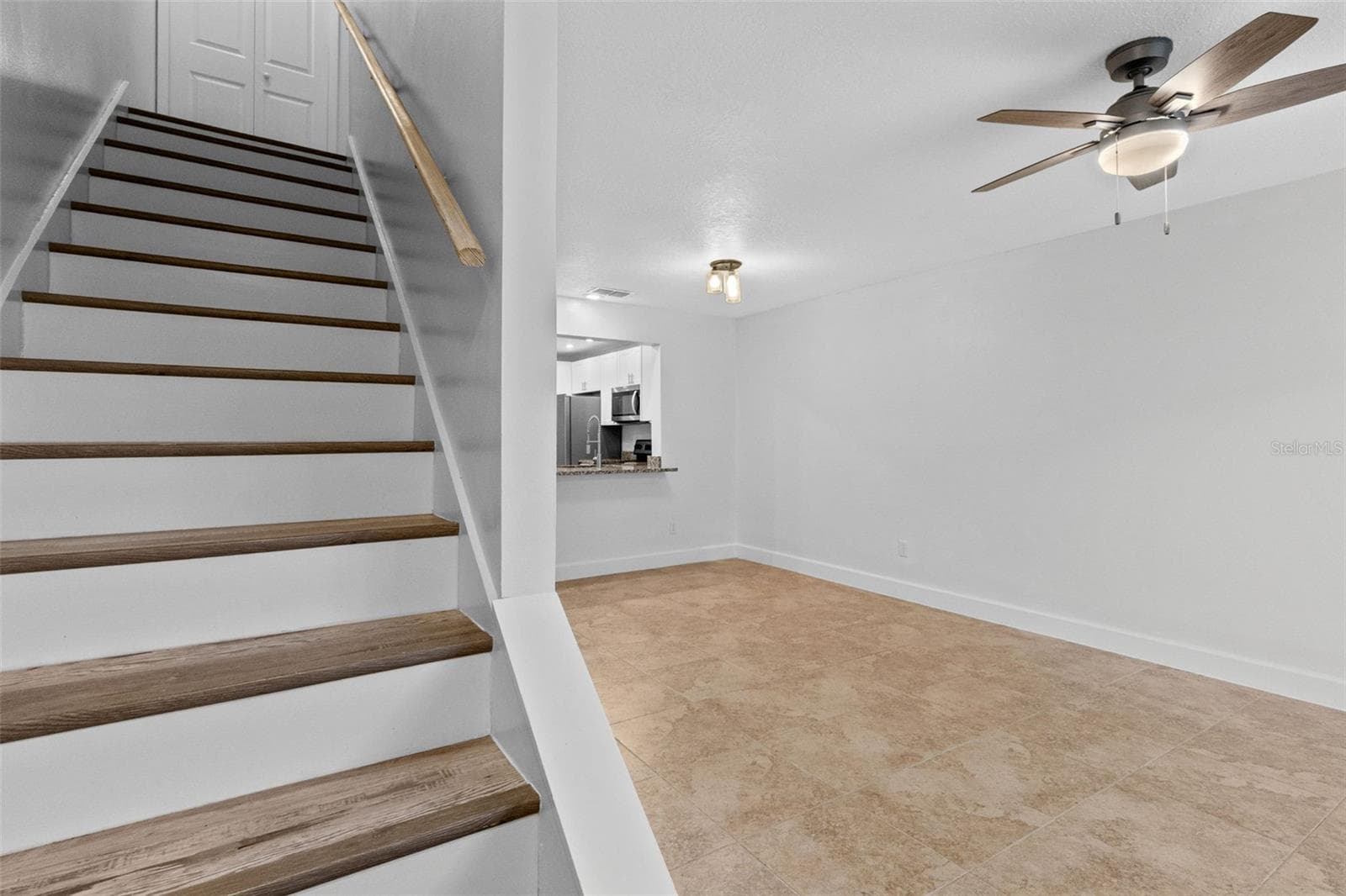 The main level features a spacious open living and dining area with plenty of room to create separate gathering and dining spaces while maintaining an easy flow throughout the home. - 283 SANDLEWOOD TRL #3, WINTER PARK