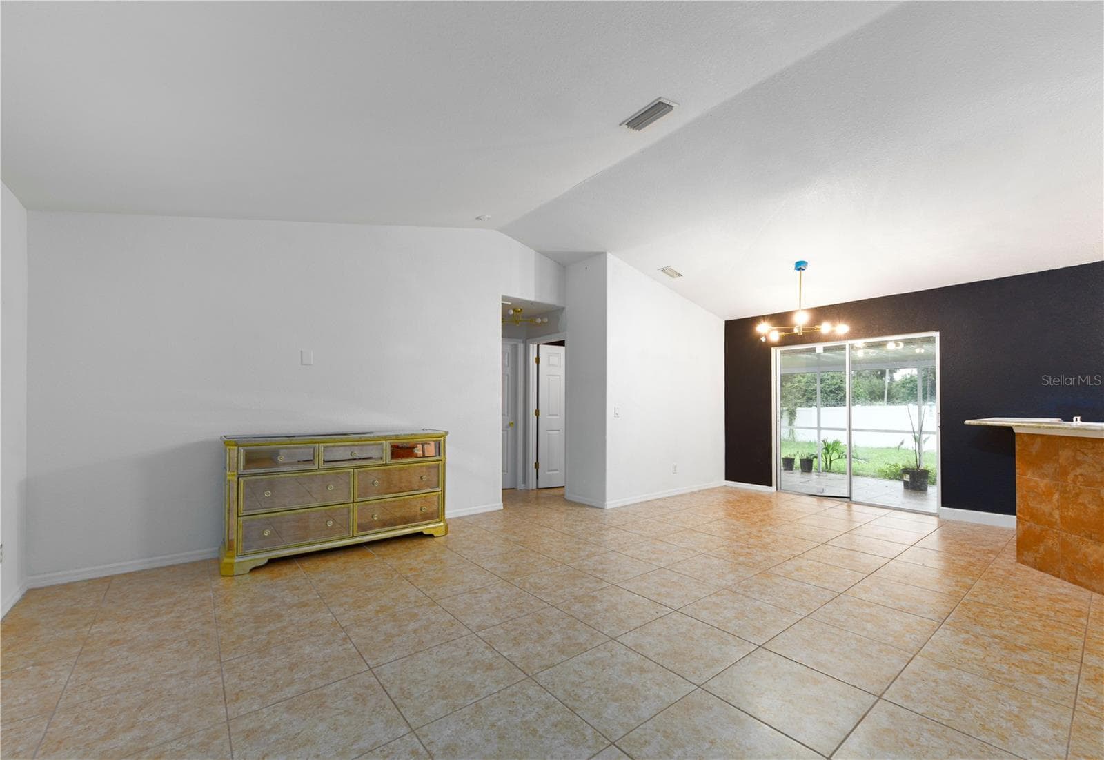 Living and dining room with cathedral ceiling - 8457 BRISTOL AVE, NORTH PORT