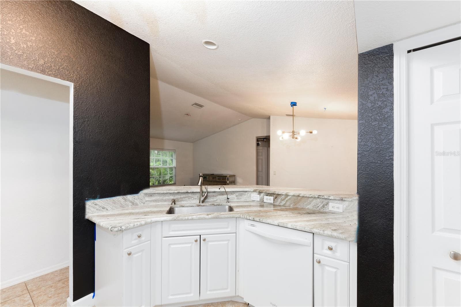 Kitchen with view to the dining and living areas - 8457 BRISTOL AVE, NORTH PORT