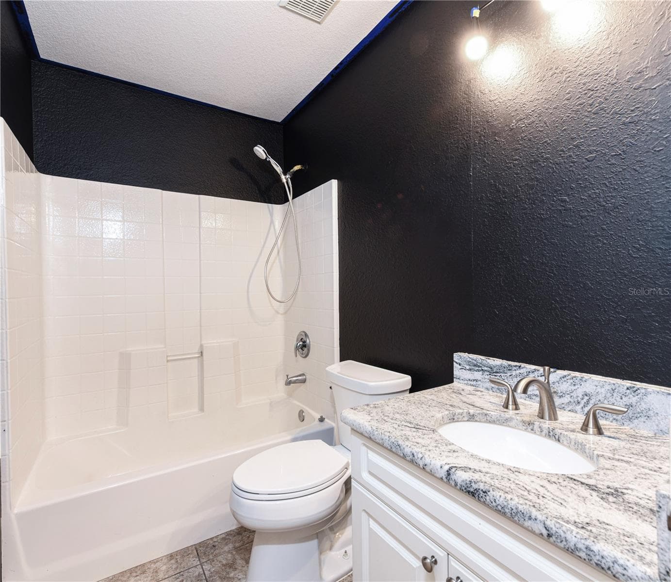 Second bathroom with granite counter top and undercount sink - 8457 BRISTOL AVE, NORTH PORT
