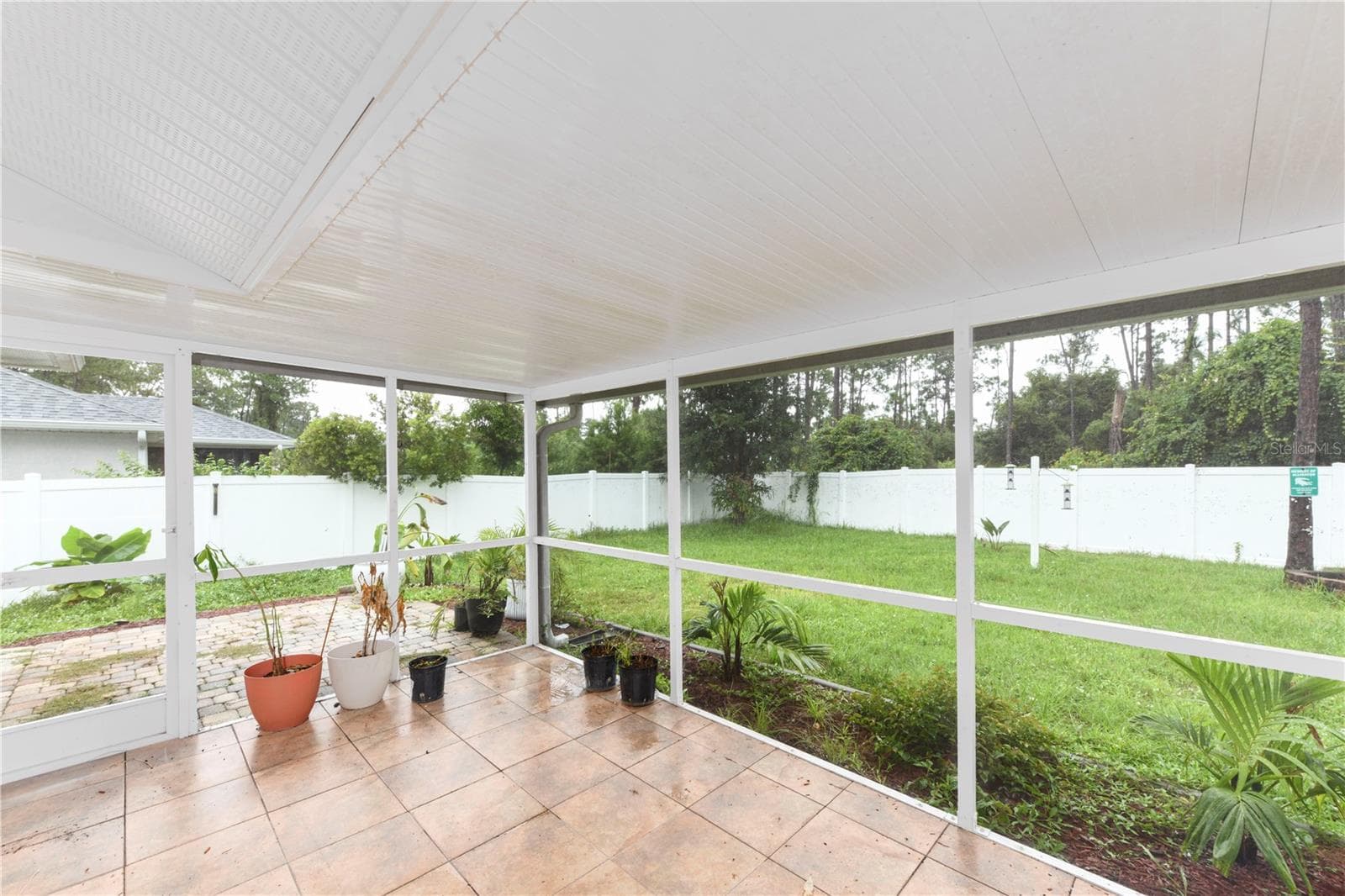 covered lanai on the back of the house. - 8457 BRISTOL AVE, NORTH PORT