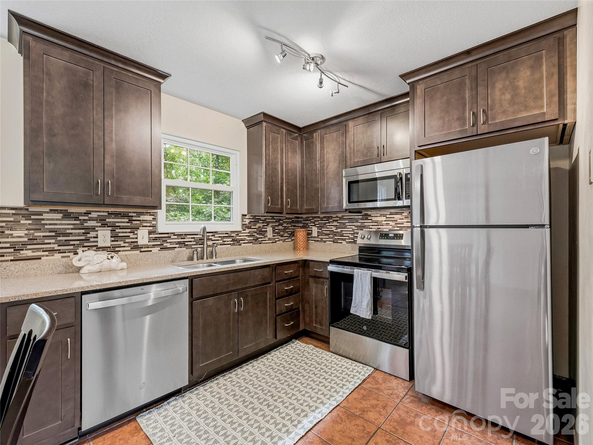 Single Family Residence at 1019 Mountain Drive, Candler, photo 7 of 28