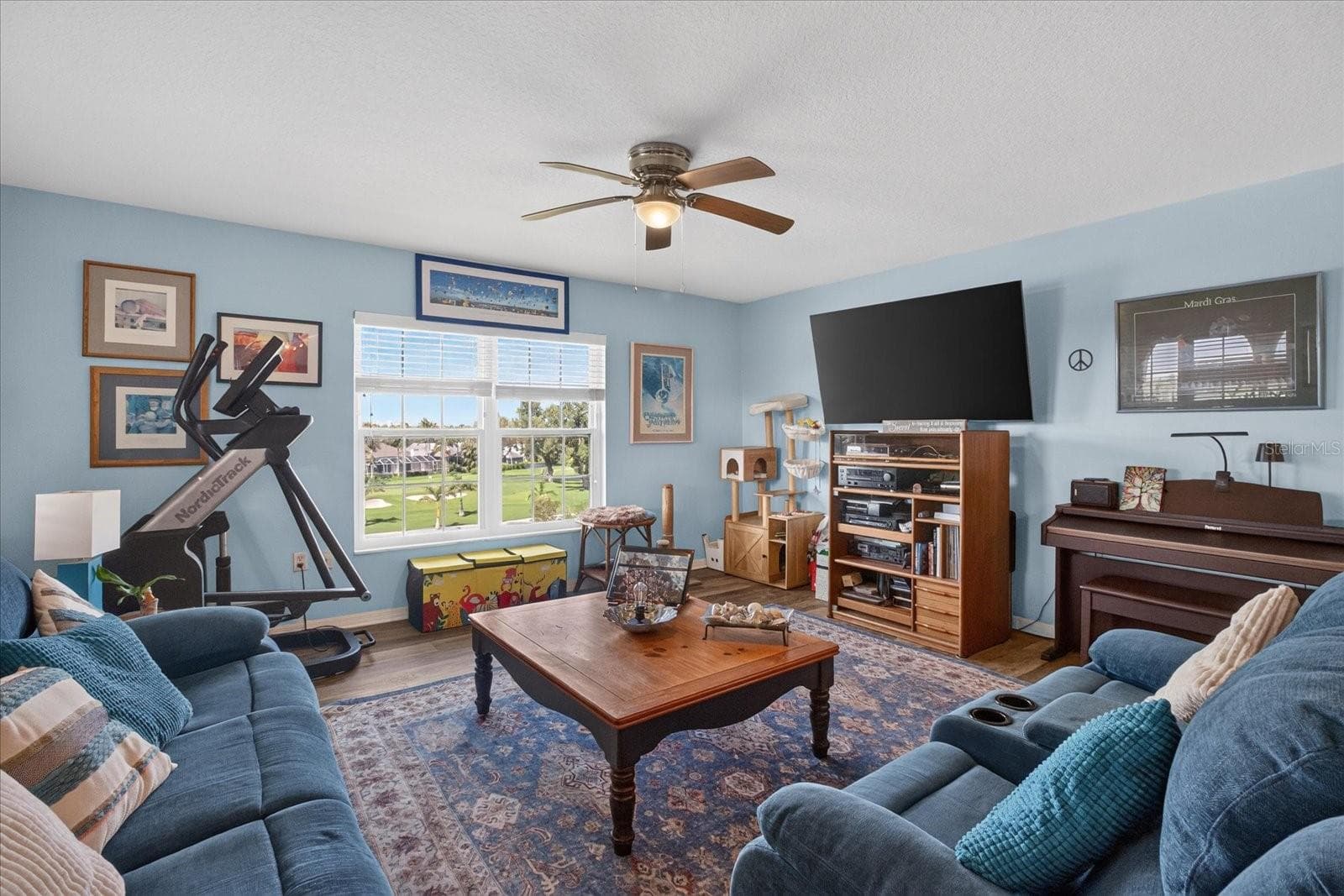 Living Room With Luxury Vinyl Plank and Impact Windows Installed in 2025 - 6100 GULFPORT BLVD S #401, GULFPORT
