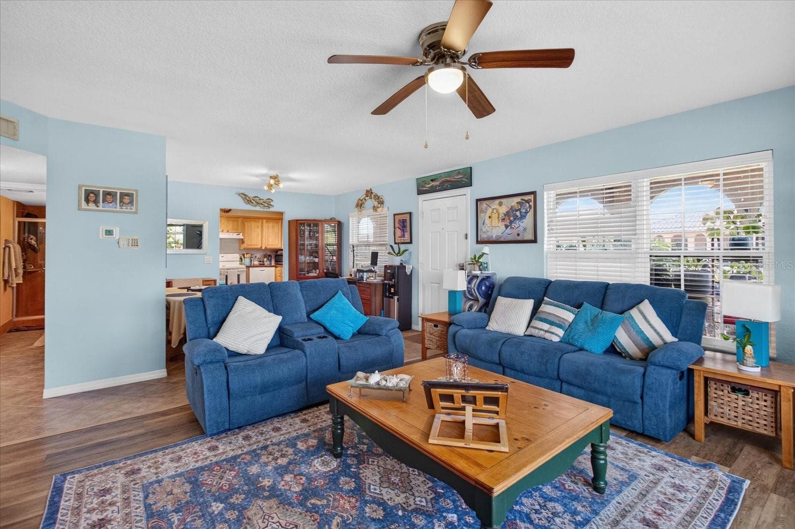 Living Room With Luxury Vinyl Plank and Impact Windows Installed in 2025 - 6100 GULFPORT BLVD S #401, GULFPORT