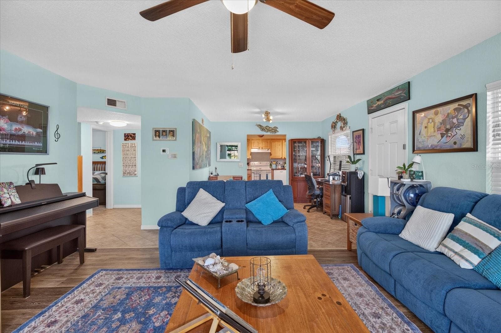Living Room With Luxury Vinyl Plank and Impact Windows Installed in 2025 - 6100 GULFPORT BLVD S #401, GULFPORT