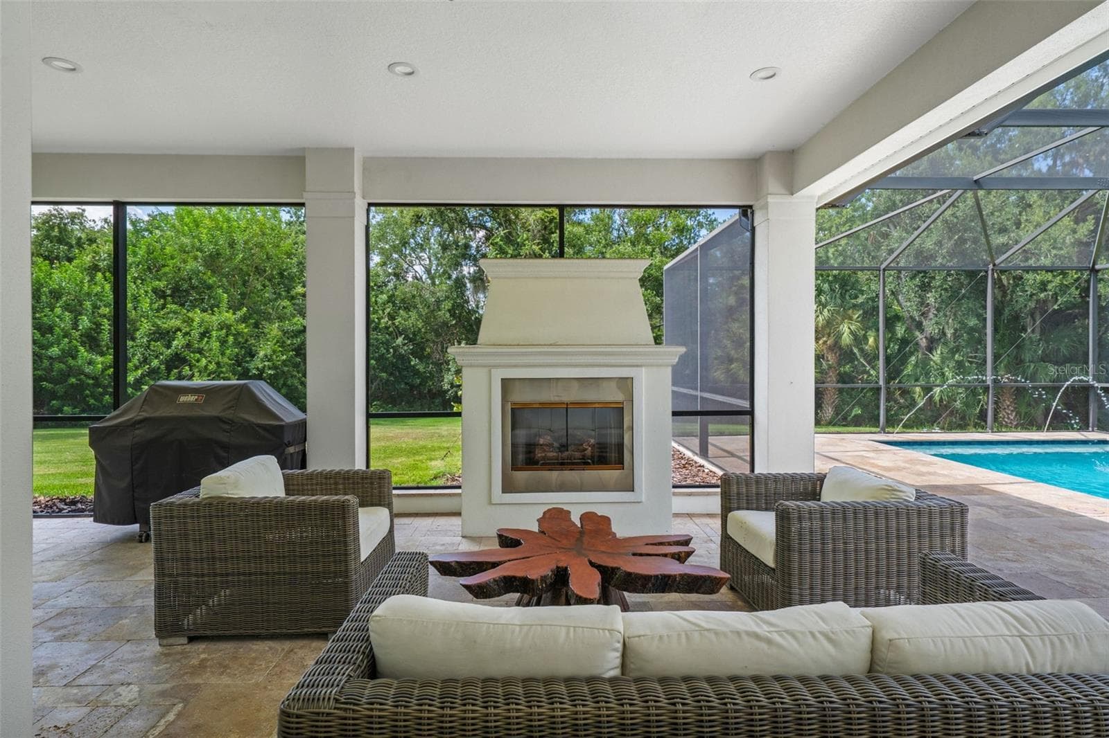 Covered Seating Area with Outdoor Fireplace - 14205 9TH TER NE, BRADENTON