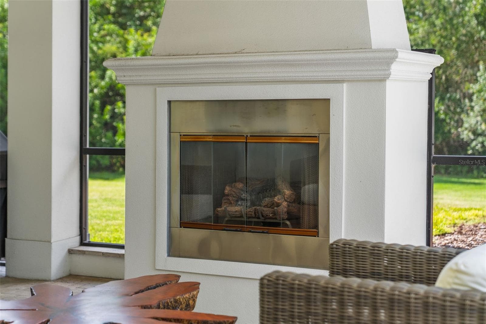 Covered Seating Area with Outdoor Fireplace - 14205 9TH TER NE, BRADENTON