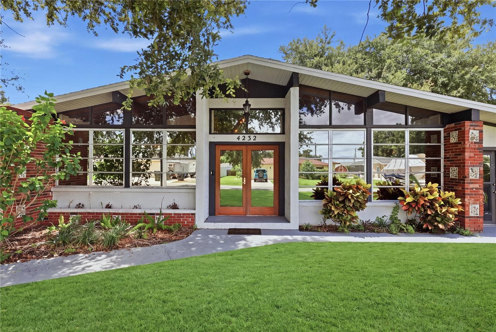 Front of Home- Front yard has been enhanced by A.I. - 4232 PANDORA RD, VENICE