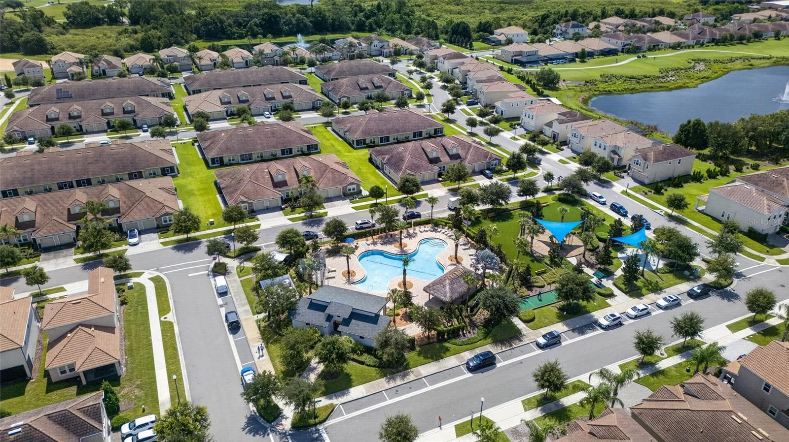 Resort-style living at ChampionsGate! Enjoy incredible community amenities including resort pools, a lazy river, water slides, splash areas, clubhouse, fitness center, dining, sports courts and more—all designed to make every day feel like a vacation. - 8813 BETH PAGE LN, DAVENPORT