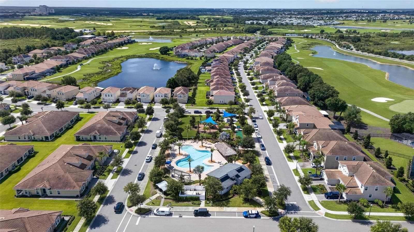 Resort-style living at ChampionsGate! Enjoy incredible community amenities including resort pools, a lazy river, water slides, splash areas, clubhouse, fitness center, dining, sports courts and more—all designed to make every day feel like a vacation. - 8813 BETH PAGE LN, DAVENPORT