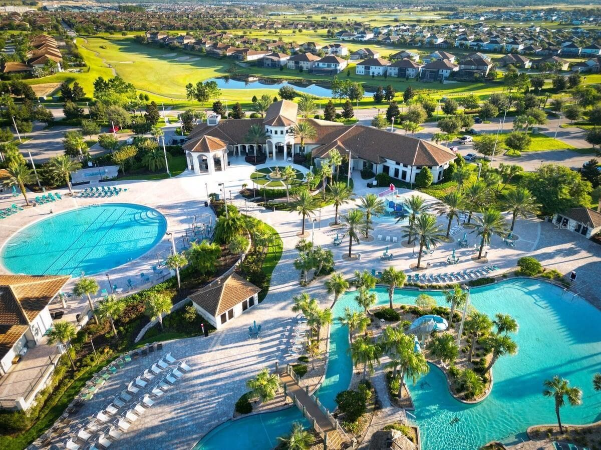 Resort-style living at ChampionsGate! Enjoy incredible community amenities including resort pools, a lazy river, water slides, splash areas, clubhouse, fitness center, dining, sports courts and more—all designed to make every day feel like a vacation. - 8813 BETH PAGE LN, DAVENPORT