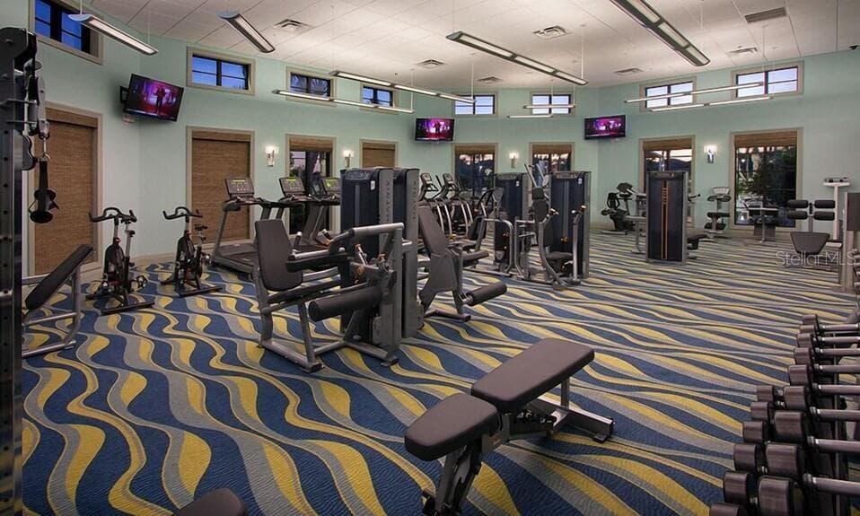 Resort-style living at ChampionsGate! Enjoy incredible community amenities including resort pools, a lazy river, water slides, splash areas, clubhouse, fitness center, dining, sports courts and more—all designed to make every day feel like a vacation. - 8813 BETH PAGE LN, DAVENPORT