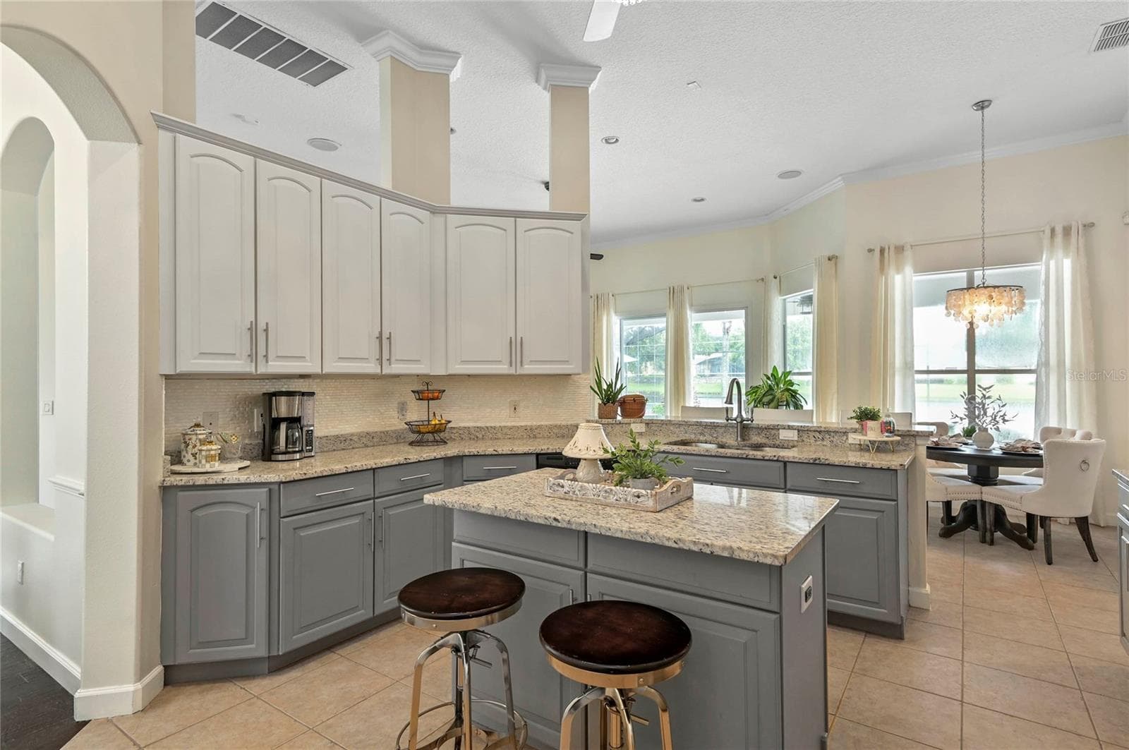 kitchen updated cabinets and oversize island - 2848 ALOMA LAKE RUN, OVIEDO
