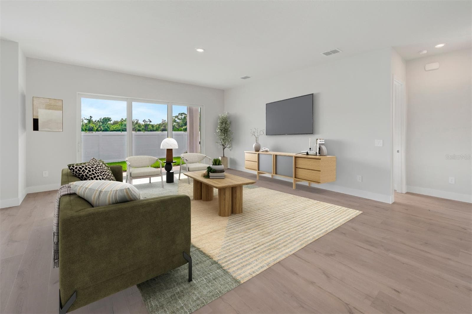 Family Room **Virtually Stages - 6823 HERON MEADOW DR, SARASOTA