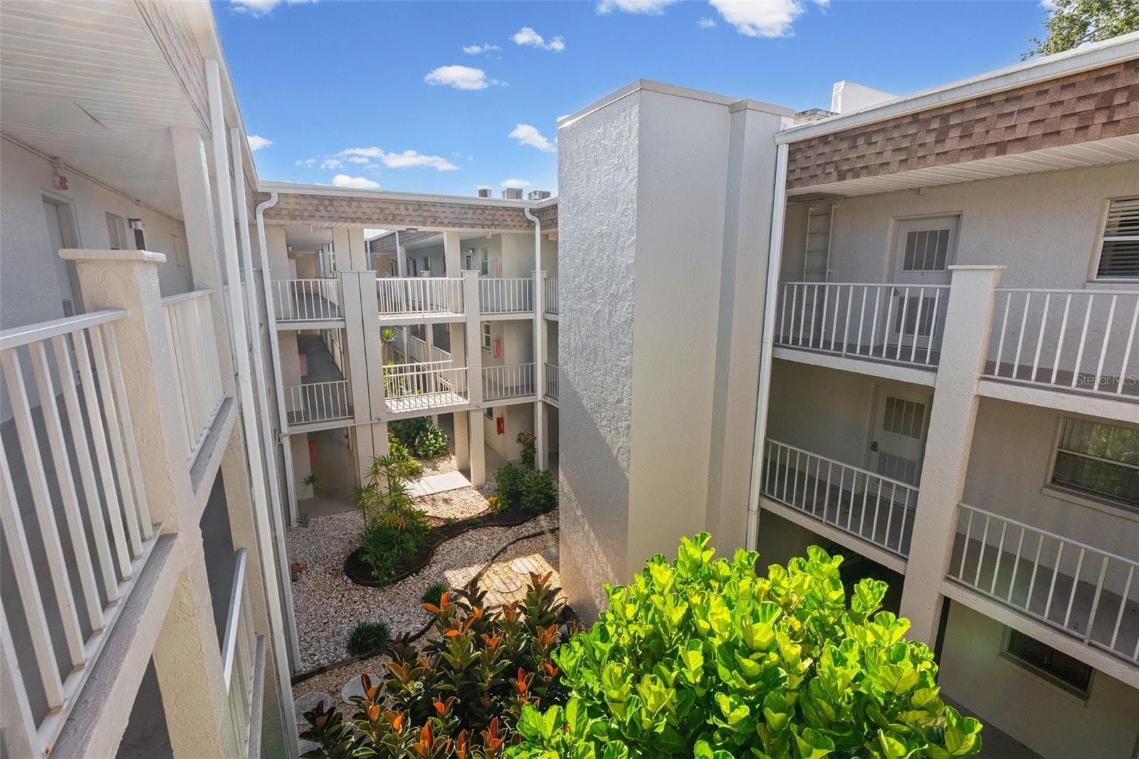 View stepping outside front door with elevator - 1310 GLEN OAKS DR E #383E, SARASOTA